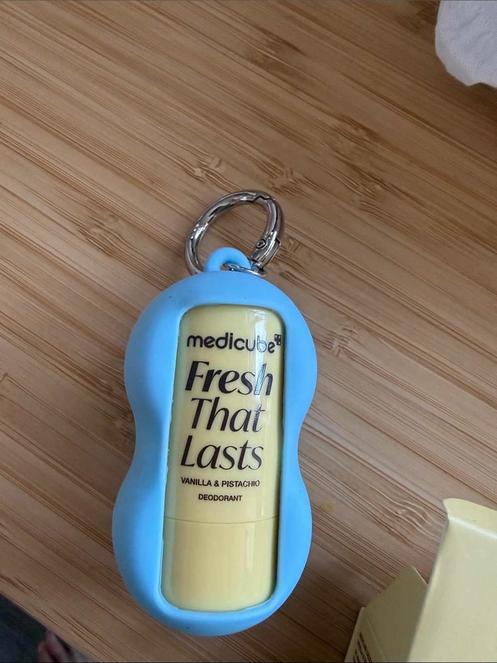 medicube Blue Keychain Holder with Yellow Fresh That Lasts Deodorant